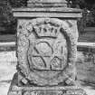 East fountain, one face of plinth, intertwined letters (MGS) encircled by wreaths and surmounted by a crown, detail