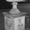 South East garden steps, ornamental urn on heraldic plinth