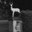 Deer statue, detail on monogrammed plinth