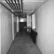 Interior.
View of basement corridor lined with cupboards.