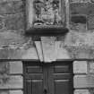 East wing West front detail of door with keystone inscribed AL GD 1741 and armorial panel over.