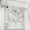 Detail of plaster panel above fireplace in entrance hall