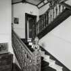 Interior view of the carved wooden staircase on the ground floor seen from the South East.