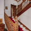 Interior view of the carved wooden staircase on the ground floor seen from the South East.