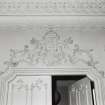 Interior detailed view of the plaster decoration above the door in the drawing room on the first floor.