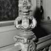 Interior detail of the carved newel post on the first floor staircase.