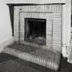 Interior detailed view of the fireplace in the maid's room at the North East side of the second floor.