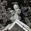 Detailed view of a stone finial seen from the roof.