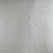 Detail of embossed ceiling paper in second floor corridor