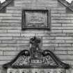 Detail of window pediment and plaque inscribed 'GEORGE HERIOTS HOSPITAL SCHOOLS JOHN CHESSER ARCHITECT'