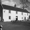 View of farm-house from SW (with sheep dog)