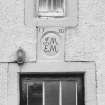 Detail of marriage lintel dated 1730 above farm-house door