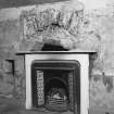 Detail of fireplace in South room on first floor.