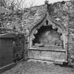 General view of canopied tomb with recumbant effigy.