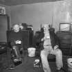 Interior: Mr John Lorimer and friend in main living room