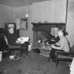 Interior: Mr John Lorimer in main living room with Miss Alison Darragh