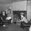 Interior: Mr John Lorimer in main living room with Miss Alison Darragh