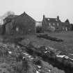 View from S showing mill (left) and miller's house (right), with tailrace in foreground