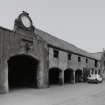 Athelstaneford Mains.
View of N side of steading from NE, including clock, bovine sculpture, and 1860 date plaque.