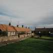 Athelstaneford Mains.
View from W of associated range farm cottages on E side of road.
