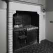 Interior.
Detail showing fireplace in servants room.
