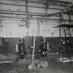 Interior view of boiler houseshowing small pumps and some of the pipework.