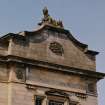 Detail of carved figure of sphinx above pediment at north end of east front