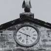 Detail of clock in pediment of central block.