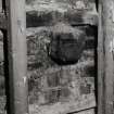 Interior.
Detail of first floor S wall showing sawn off beam end.