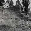 Detail of walling at E end of church from NW.