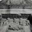 Detail of top of funerary monument's central panel.