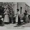 Photographic copy of a postcard.
View of a group of women on washing day.
Titled: 'Washing Day in Musselboro''.