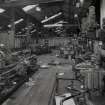 Interior.
View of ropery from W within Engineers Machine Shop, including lathe (left) and Archdale Drill (right).