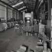 Interior.
View of ropery from E at W end of Rigging Shop, showing 1000-ton  (foreground right) and 500-ton (distant left) Presses (Note that British Ropes and Bruntons were not associated).