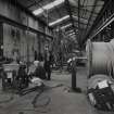 Interior.
View of ropery from E of stock rope racks, with three members of staff salvaging plant for sale, following closure.