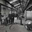 Interior.
View of ropery from E of stock rope racks, with three members of staff preparing plant for post-closure sale.