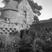 Copy of historic photograph showing view of gardens and summerhouse from W.