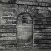 North facade, detail of blocked doorway with keystone insc: '1803'