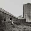 View of N side of farm from E, showing 2 concrete silage towers