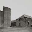 View from NW of 2 concrete silage towers (at NE side of farm)