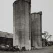 View from NE of 2 concrete silage towers