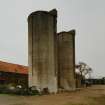 View from NE of 2 concrete silage towers