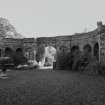 View of arcade flanking the entrance arch from W