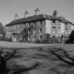 View from SW showing garden and entrance fronts.