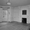 Interior. 
First floor original dining room, view from North showing Edwardian fireplace flanked by Ionic pilasters.