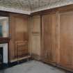 Interior.
First floor panelled bathroom, view from North with bath door panels closed.