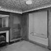 Interior.
First floor panelled bathroom, view from North with bath door panels open.