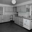 Interior. 
First floor fitted kitchen c. 1950, view from E.