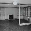 Interior. 
Ground floor Southwest or garden room, view from South showing fireplace and bookshelves.