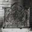 Interior.
Detail of cast iron plaque on fireplace.